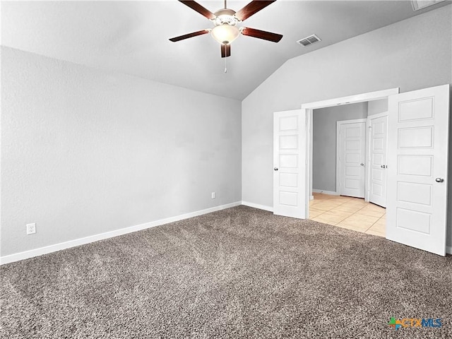 1938 Reserve Way, New Braunfels, TX 78130 - unfurnished bedroom featuring light carpet, lofted ceiling, baseboards, light tile patterned floors, and a ceiling fan