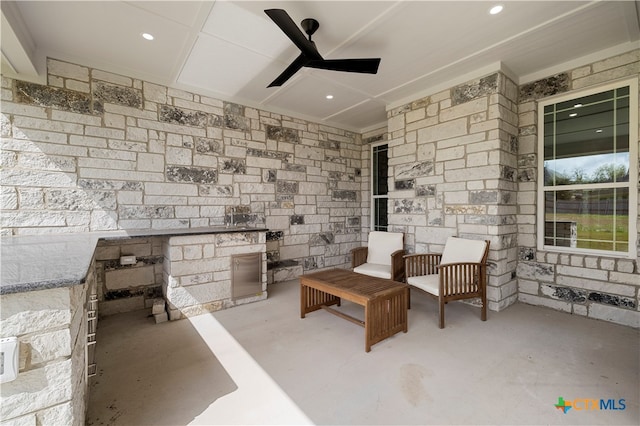 view of patio featuring ceiling fan