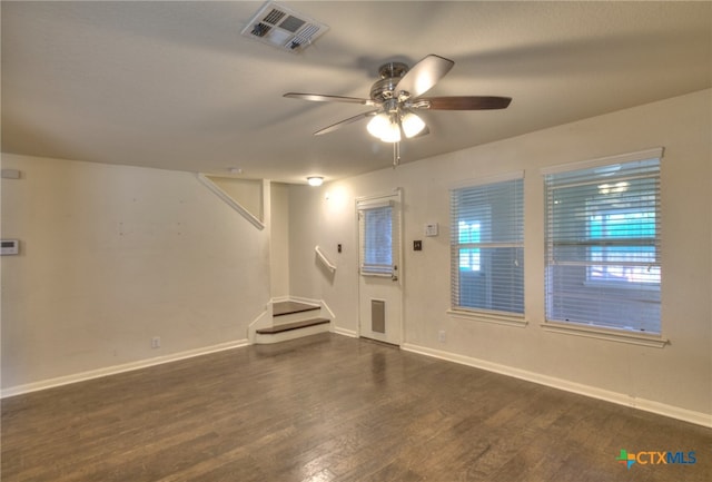 interior space featuring ceiling fan and dark hardwood / wood-style flooring