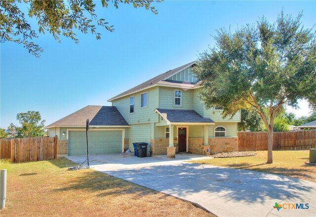 view of front facade with a garage and a front yard