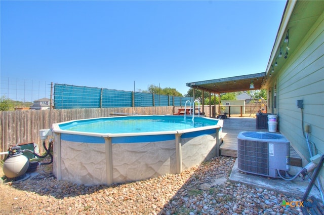 view of pool with central AC