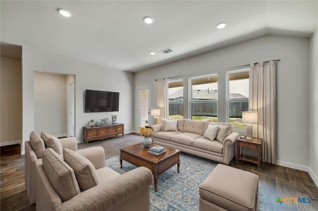 living room with recessed lighting, visible vents, vaulted ceiling, baseboards, and wood finished floors