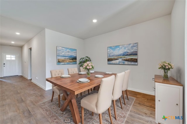 dining area featuring recessed lighting, light wood-style flooring, and baseboards