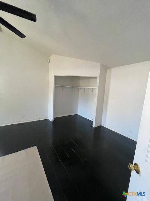 empty room featuring dark wood-type flooring