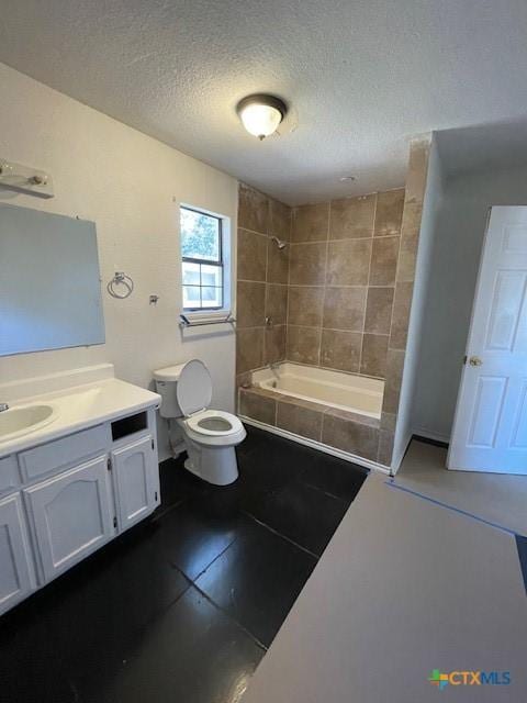 full bathroom featuring tiled shower / bath combo, vanity, a textured ceiling, tile patterned floors, and toilet