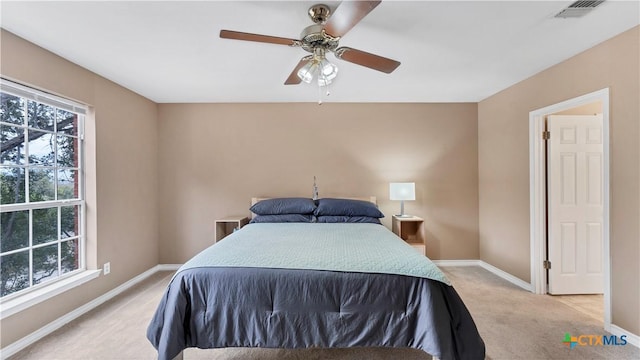 carpeted bedroom featuring ceiling fan