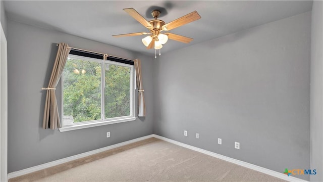 carpeted empty room with ceiling fan