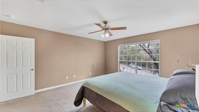 bedroom with ceiling fan and carpet floors