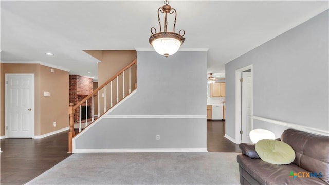 living room with ceiling fan, hardwood / wood-style floors, and ornamental molding