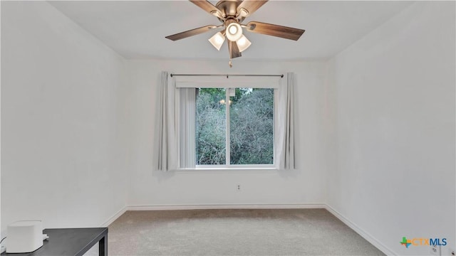 empty room with ceiling fan and carpet floors