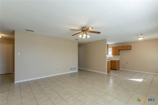 unfurnished room featuring ceiling fan and light tile patterned flooring