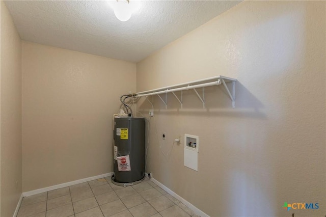 laundry room featuring hookup for a washing machine, a textured ceiling, light tile patterned floors, and water heater