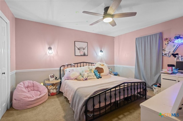 carpeted bedroom featuring a ceiling fan