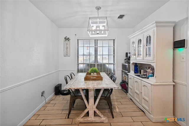 dining area with visible vents and wood tiled floor
