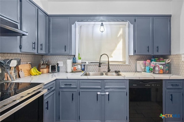 kitchen with light countertops, stove, a sink, and dishwasher