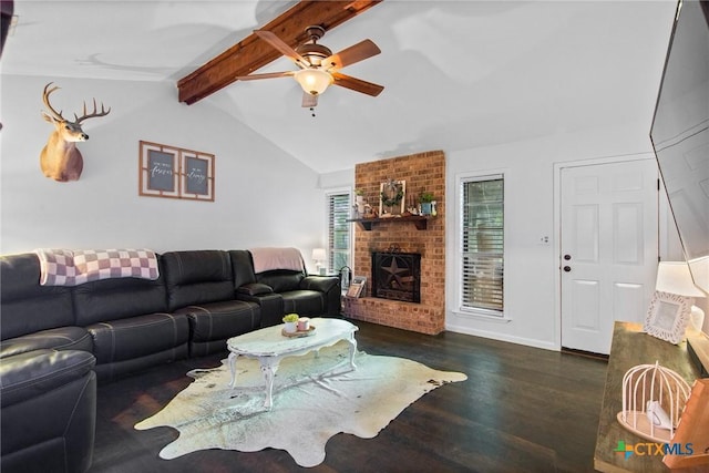living area featuring ceiling fan, lofted ceiling with beams, a fireplace, baseboards, and wood finished floors
