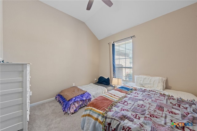 bedroom with vaulted ceiling, ceiling fan, and carpet