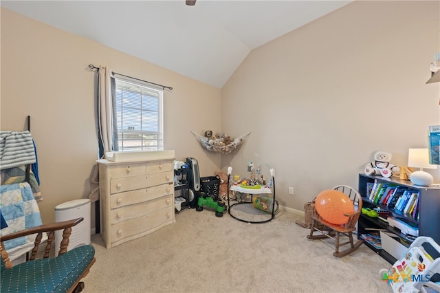 playroom featuring light carpet and vaulted ceiling