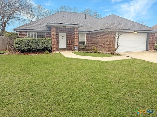 single story home with a garage and a front yard