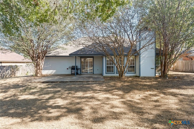 rear view of property with a patio area