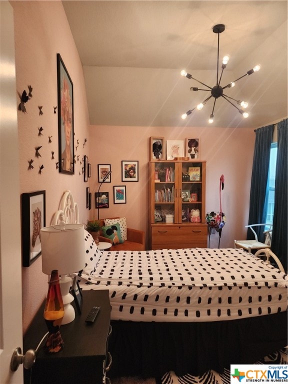 bedroom with an inviting chandelier