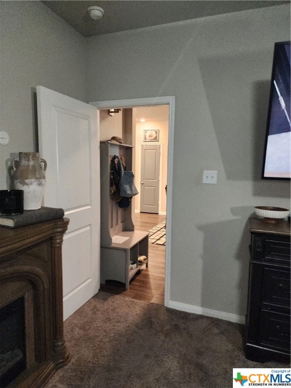 interior space featuring dark colored carpet