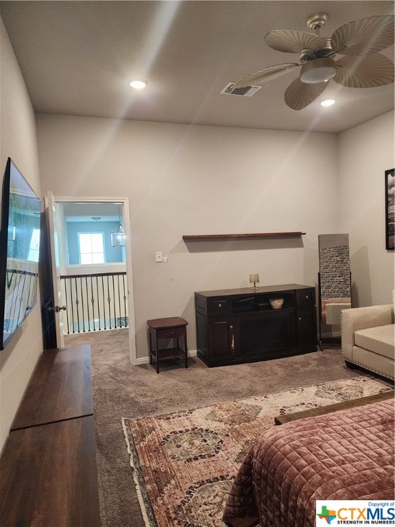 carpeted bedroom with ceiling fan