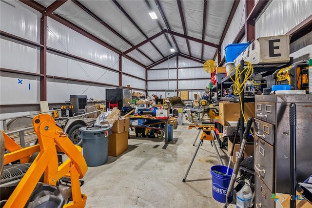 garage featuring a workshop area and metal wall