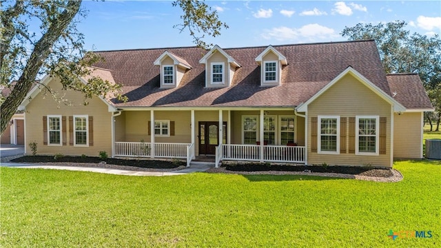 55 Post Oak Bnd, Inez, TX 77968 - cape cod home featuring covered porch, central AC unit, a front yard, and roof with shingles