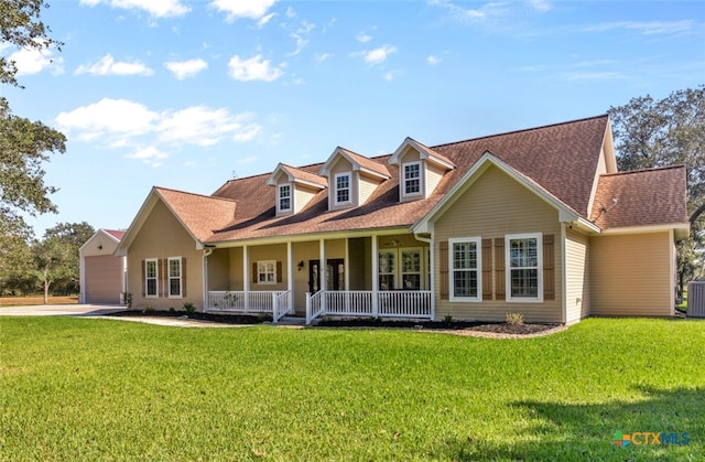 cape cod house with a front yard, covered porch, and central AC unit