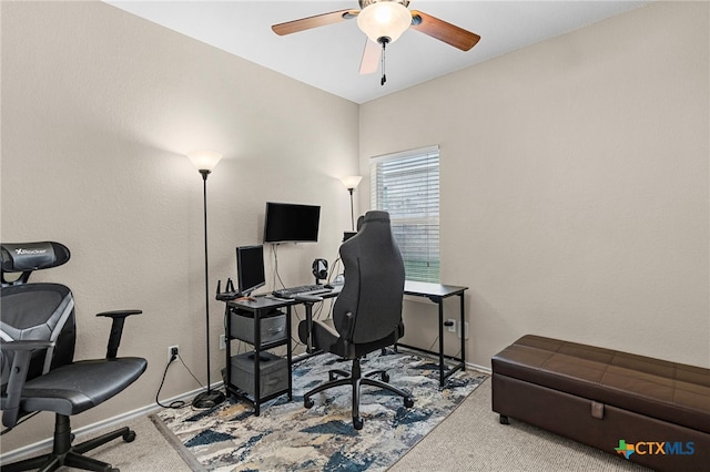 office area featuring a ceiling fan, carpet, and baseboards