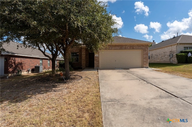 view of front facade featuring cooling unit, concrete driveway, brick siding, and an attached garage