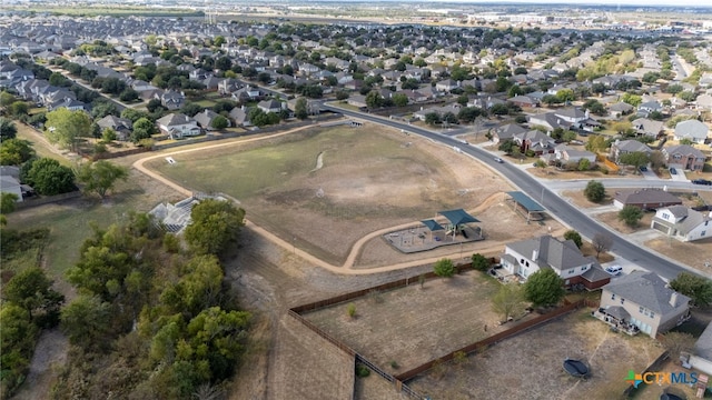 birds eye view of property with a residential view