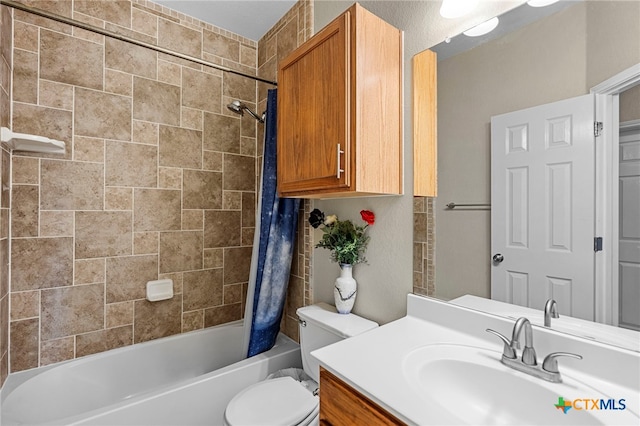 full bath with toilet, shower / tub combo, and vanity