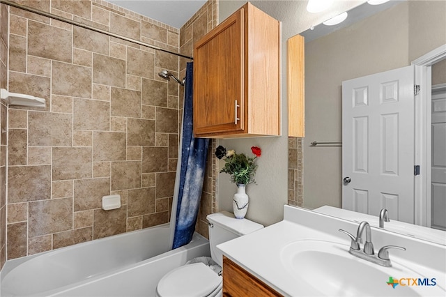 bathroom featuring shower / bathtub combination with curtain, vanity, and toilet