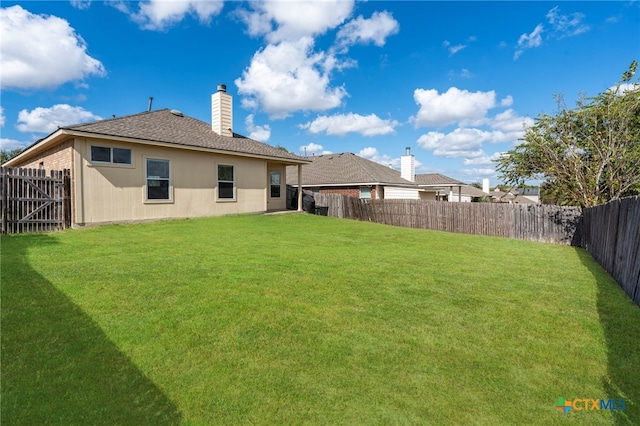 view of yard featuring a fenced backyard