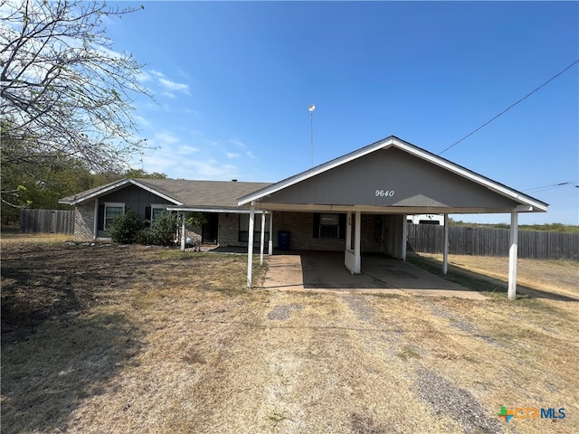 view of front of property featuring a carport