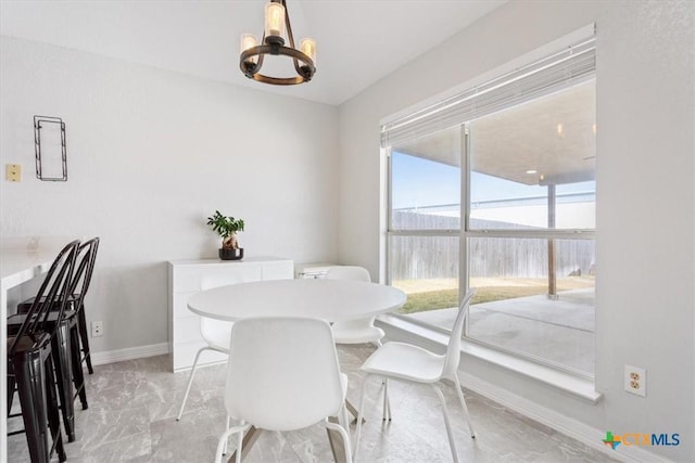 dining area with a notable chandelier