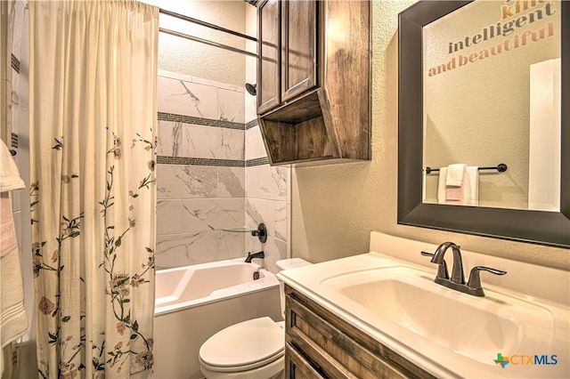 bathroom featuring vanity, shower / tub combo, toilet, and a textured wall