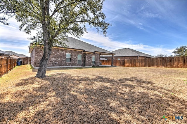 view of yard with a fenced backyard