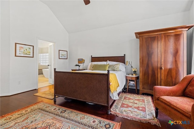 bedroom featuring ceiling fan, lofted ceiling, dark hardwood / wood-style floors, and connected bathroom