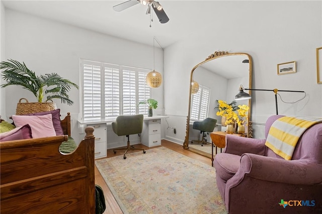 office area featuring light hardwood / wood-style floors and ceiling fan