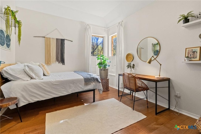 bedroom with wood-type flooring