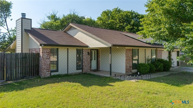 1610 Fox Trl, Harker Heights, TX 76548 - single story home featuring a garage, a chimney, roof mounted solar panels, and a shingled roof