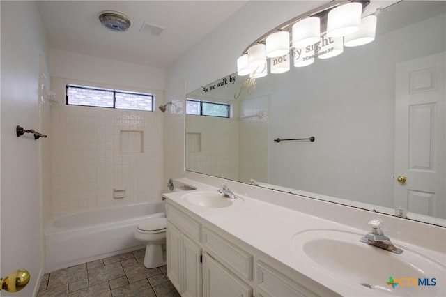 113 Ashford Dr, Victoria, TX 77904 - bathroom with toilet, double vanity, and tub / shower combination