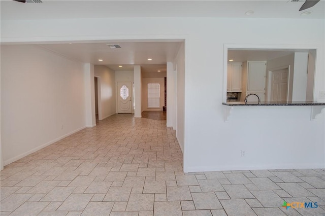 113 Ashford Dr, Victoria, TX 77904 - empty room with baseboards and recessed lighting