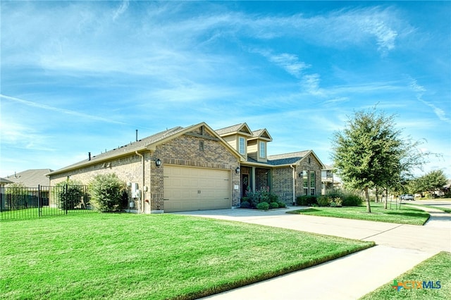 view of front of property featuring a front lawn and a garage