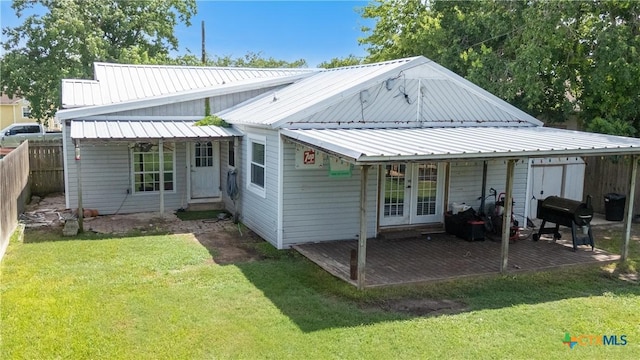 516 2nd St, Cuero, TX 77954 - back of house with a patio and a metal roof