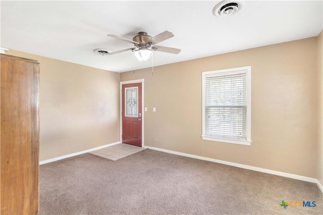 516 2nd St, Cuero, TX 77954 - carpeted foyer entrance with ceiling fan and baseboards