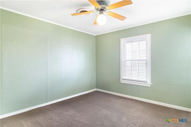 516 2nd St, Cuero, TX 77954 - empty room featuring carpet floors, ornamental molding, and ceiling fan